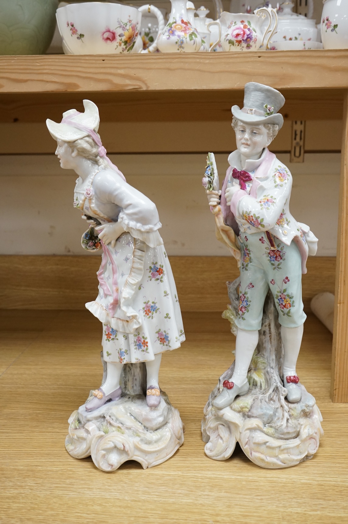A pair of large Continental porcelain figures of a lady and gentleman, late 19th century, 41cm high